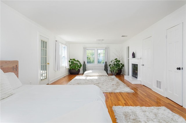 bedroom with light hardwood / wood-style floors