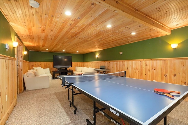 game room with light colored carpet, wooden walls, and wood ceiling