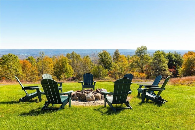 view of yard with a fire pit