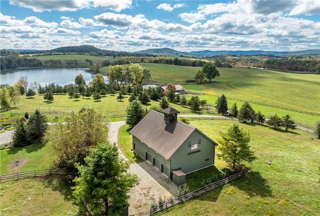 aerial view with a rural view and a water and mountain view