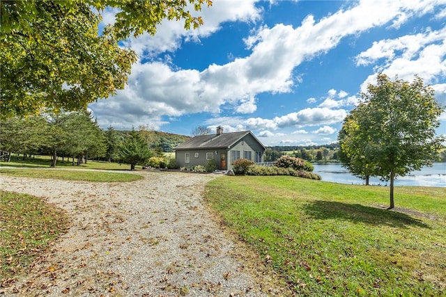 view of front of property featuring a water view and a front yard