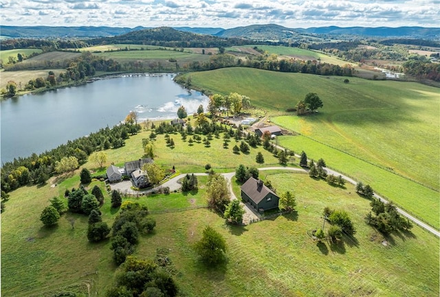 aerial view with a water and mountain view and a rural view