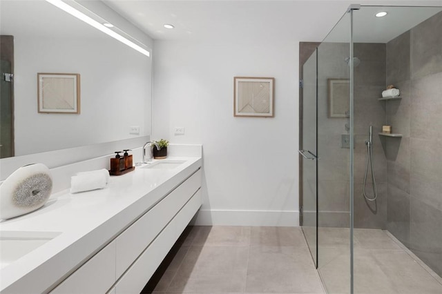 bathroom featuring vanity and a tile shower