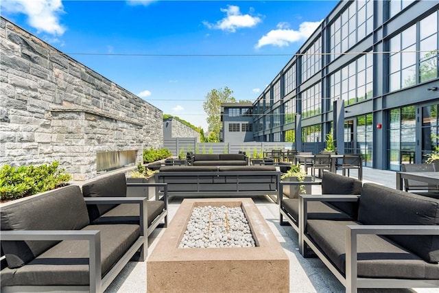 41 Richmondville Ave Unit 109, Call Listing Agent, CT 06880 - view of patio / terrace with an outdoor living space with a fireplace