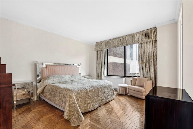 bedroom with parquet flooring and crown molding