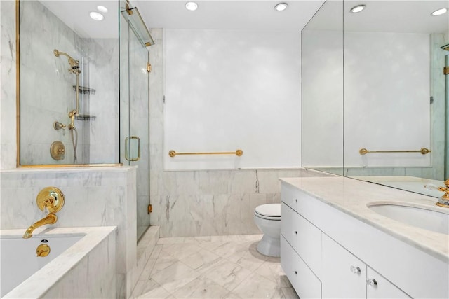 full bathroom with vanity, toilet, tile walls, and independent shower and bath