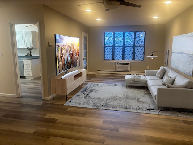 living room with ceiling fan, hardwood / wood-style floors, and a wall mounted air conditioner