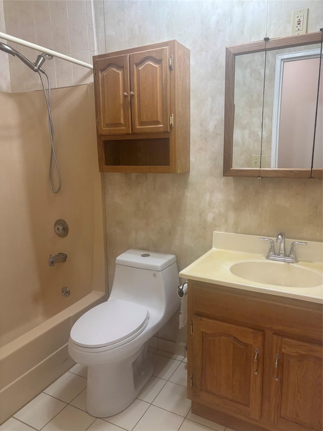 full bathroom featuring toilet, tile patterned floors, shower / washtub combination, and vanity