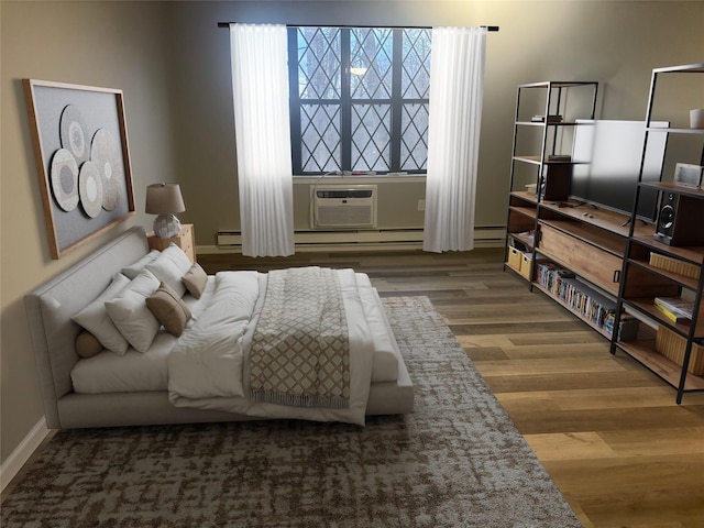 bedroom featuring a wall unit AC and hardwood / wood-style flooring