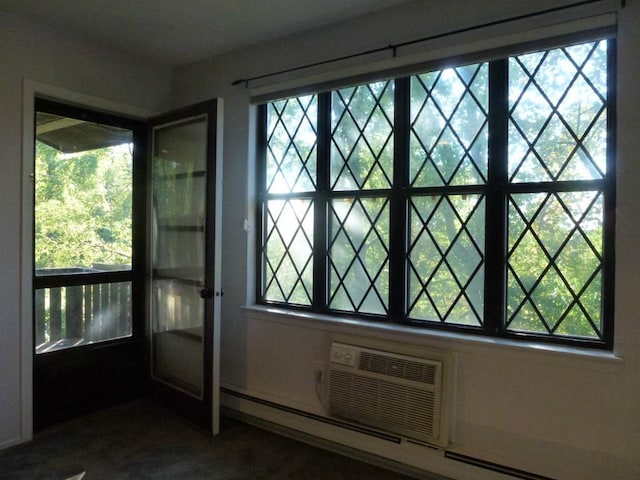 doorway to outside featuring a baseboard radiator