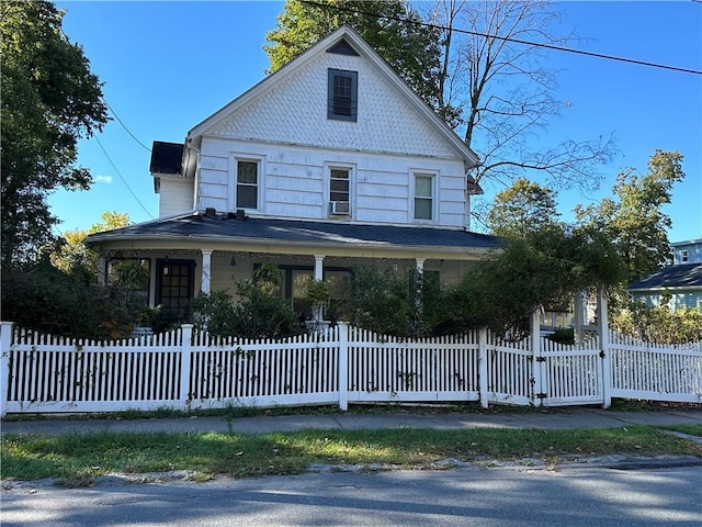 71 High St, Monticello, NY 12701 - view of front of house featuring a fenced front yard and a porch