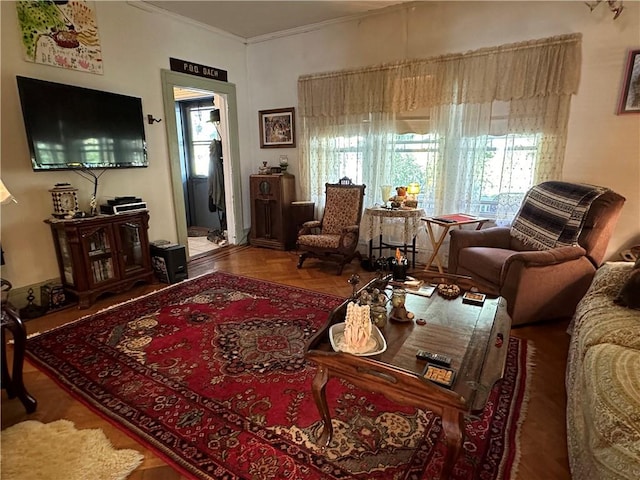 living room featuring parquet flooring and crown molding