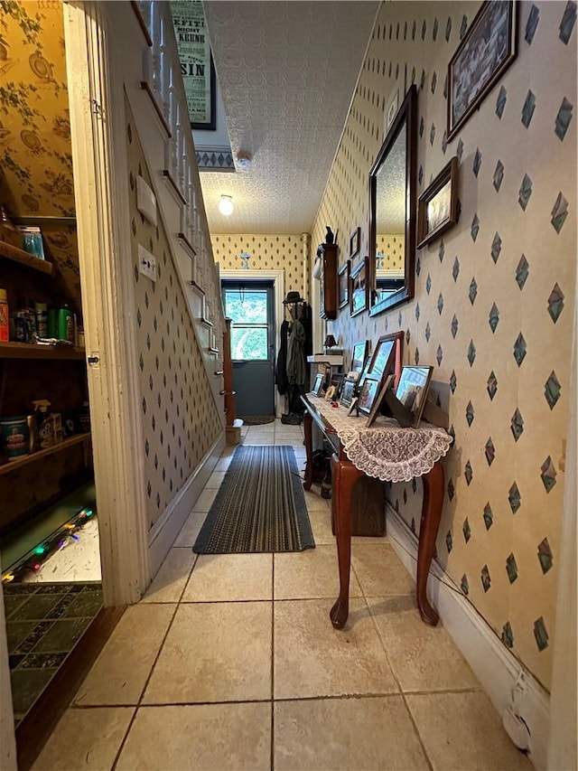 71 High St, Monticello, NY 12701 - hallway with wallpapered walls, light tile patterned flooring, and baseboards
