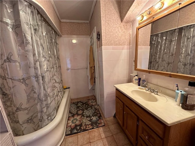 71 High St, Monticello, NY 12701 - full bathroom featuring ornamental molding, vanity, tile walls, shower / tub combo, and a wainscoted wall