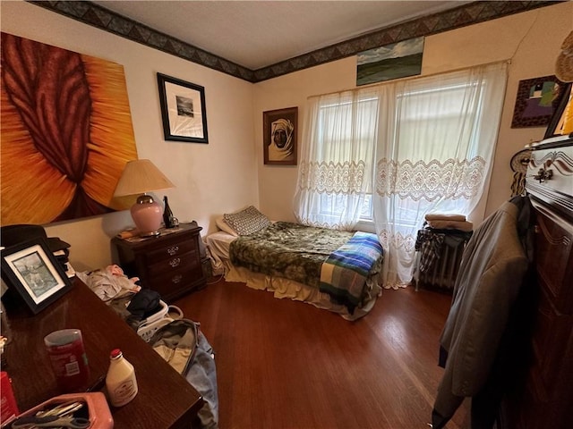 bedroom featuring wood-type flooring