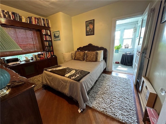 bedroom featuring dark hardwood / wood-style flooring