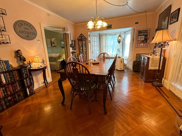 dining room featuring parquet flooring, a notable chandelier, and ornamental molding