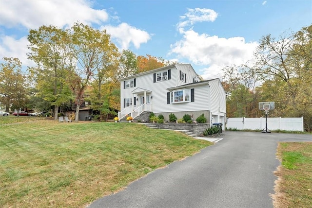 view of front of house with a front lawn and a garage