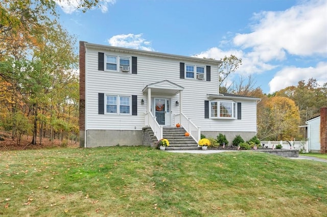 view of front of home with a front yard