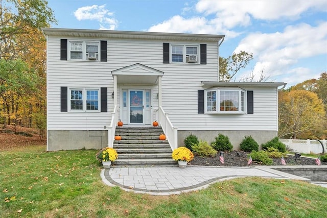 view of front of property with a front lawn