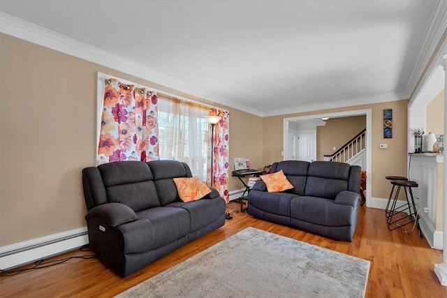 living room featuring crown molding, a baseboard radiator, and light hardwood / wood-style flooring