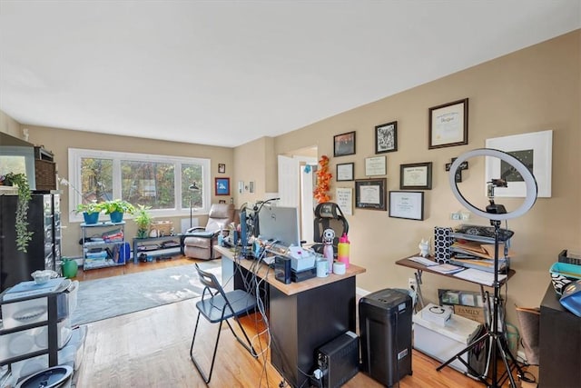 office area with light hardwood / wood-style floors