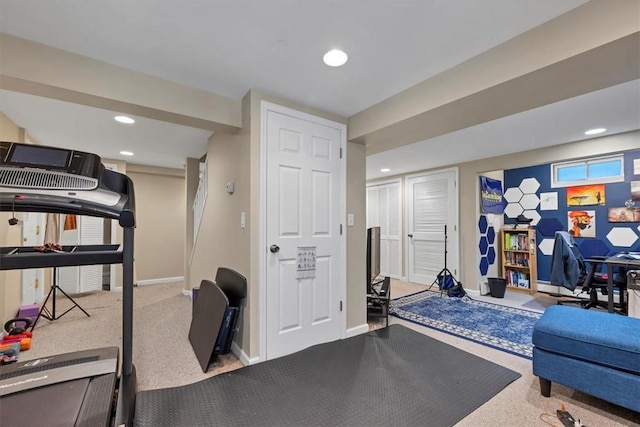 workout room featuring carpet flooring