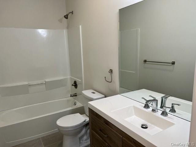 full bathroom featuring vanity, toilet, tub / shower combination, and tile patterned flooring