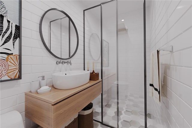 bathroom with an enclosed shower and sink