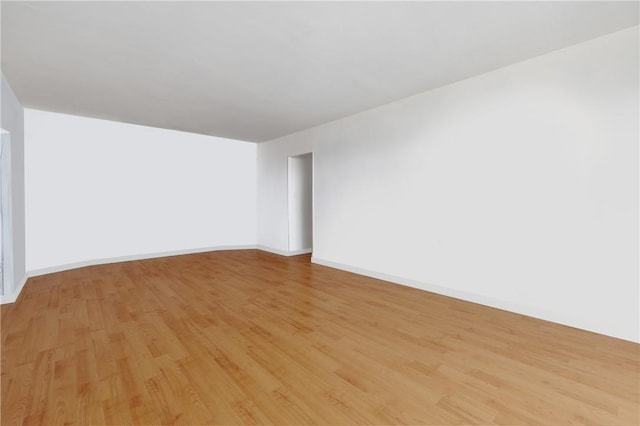 empty room with light hardwood / wood-style floors