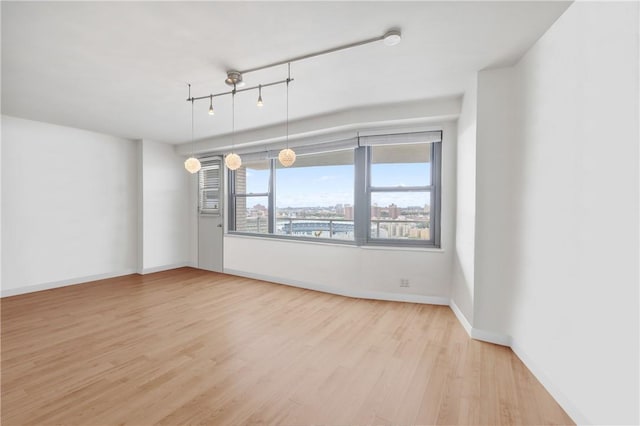 unfurnished room featuring light wood-type flooring