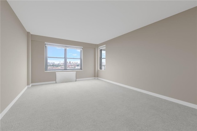 empty room with light colored carpet