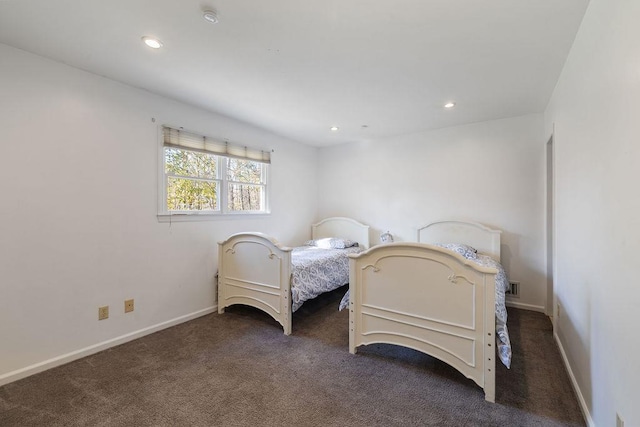 bedroom featuring dark carpet