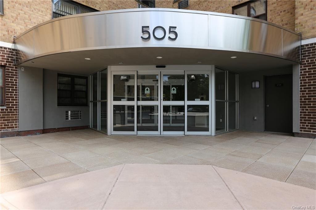 entrance to property featuring a patio