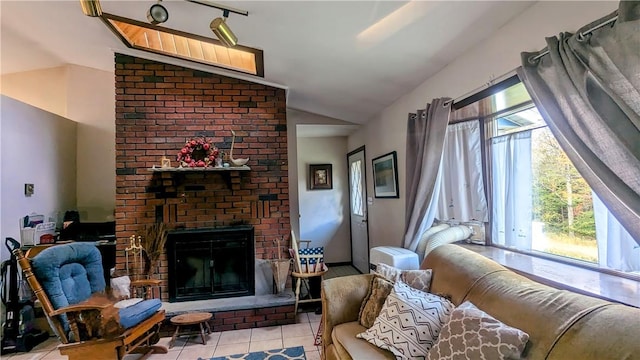 tiled living room with a brick fireplace and lofted ceiling