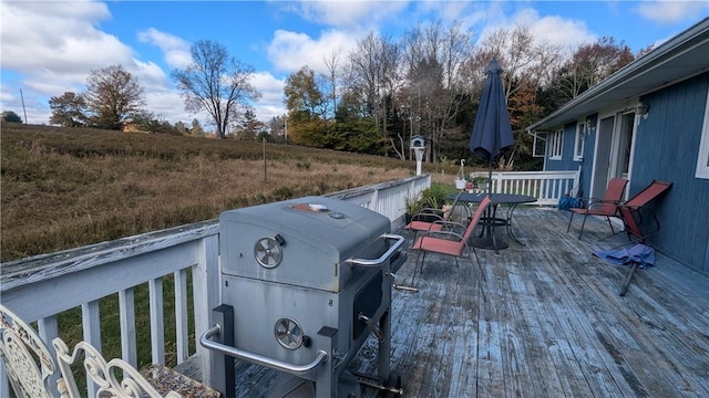 wooden terrace with area for grilling