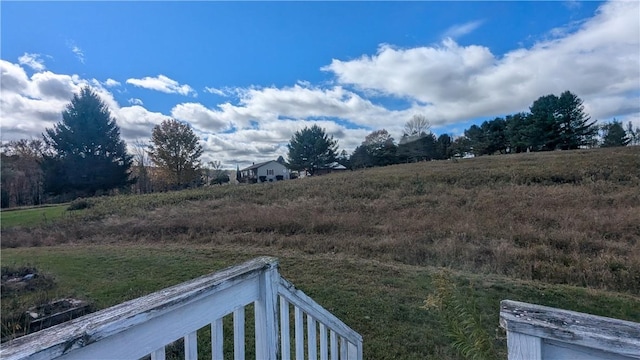 view of yard with a rural view