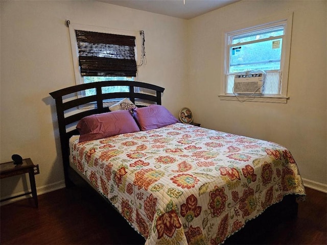 bedroom featuring dark hardwood / wood-style floors and cooling unit