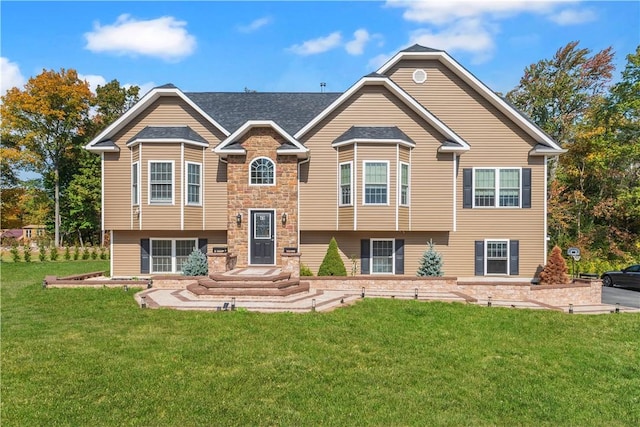 bi-level home with a front yard