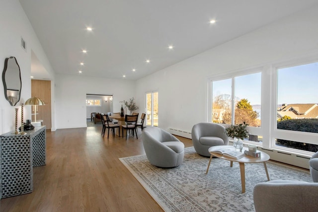 living room featuring hardwood / wood-style floors and baseboard heating