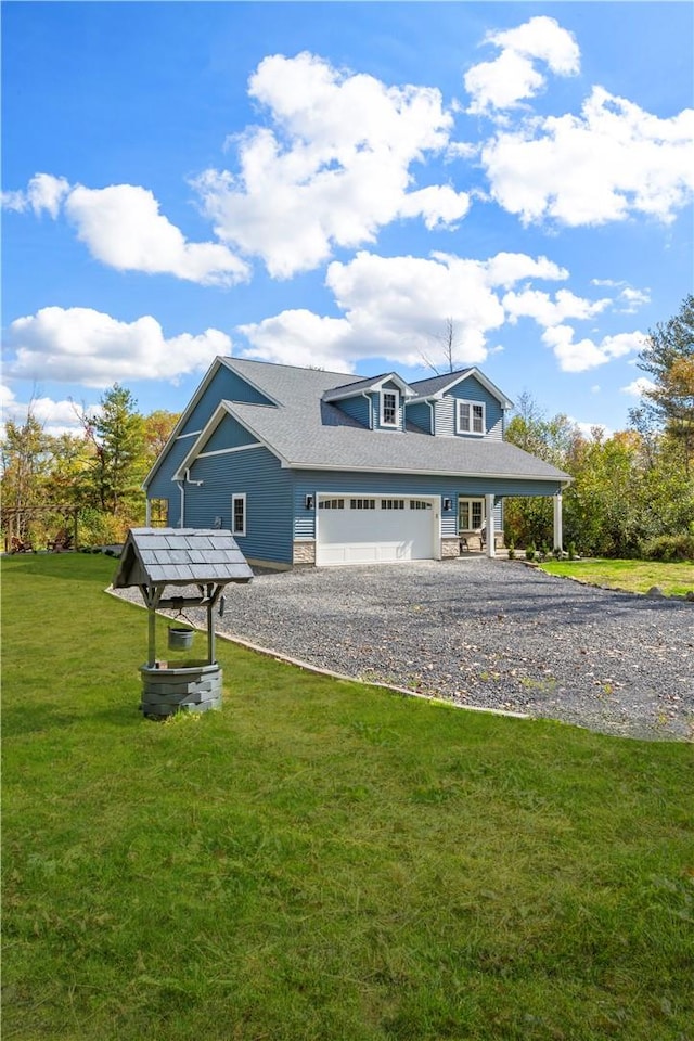 view of front of home featuring a garage and a front lawn