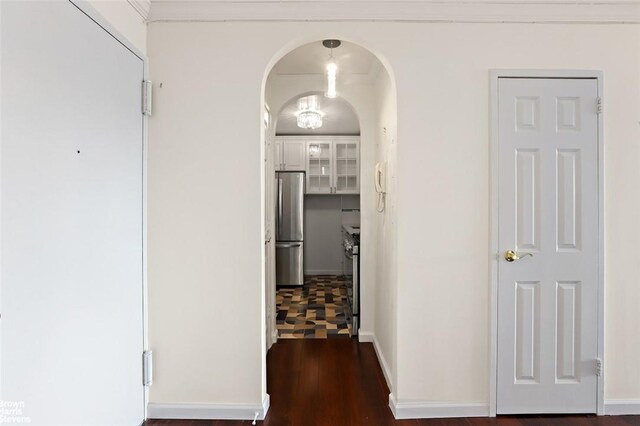 corridor with dark hardwood / wood-style floors