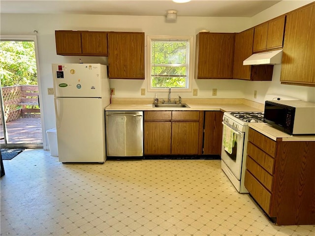 kitchen with white appliances and sink