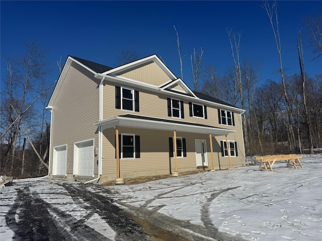 view of front of house with a garage and covered porch