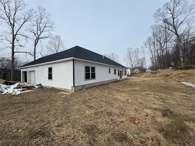 view of side of home with a garage