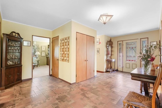 entryway featuring ornamental molding