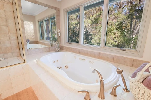 bathroom featuring tiled tub