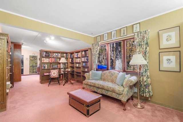 living area with carpet, crown molding, and vaulted ceiling