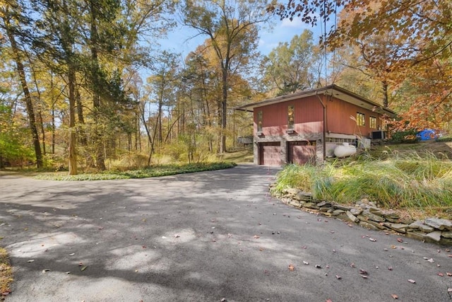 view of side of home featuring a garage