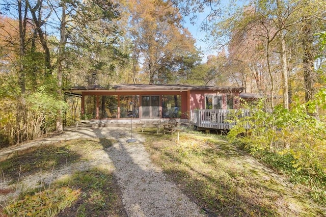 view of front facade featuring a wooden deck